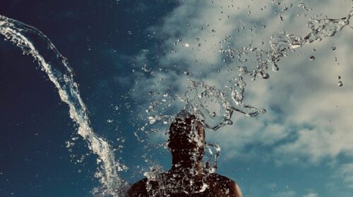man splashing with water