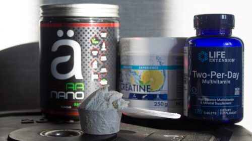 a table topped with bottles of vitamins and pills