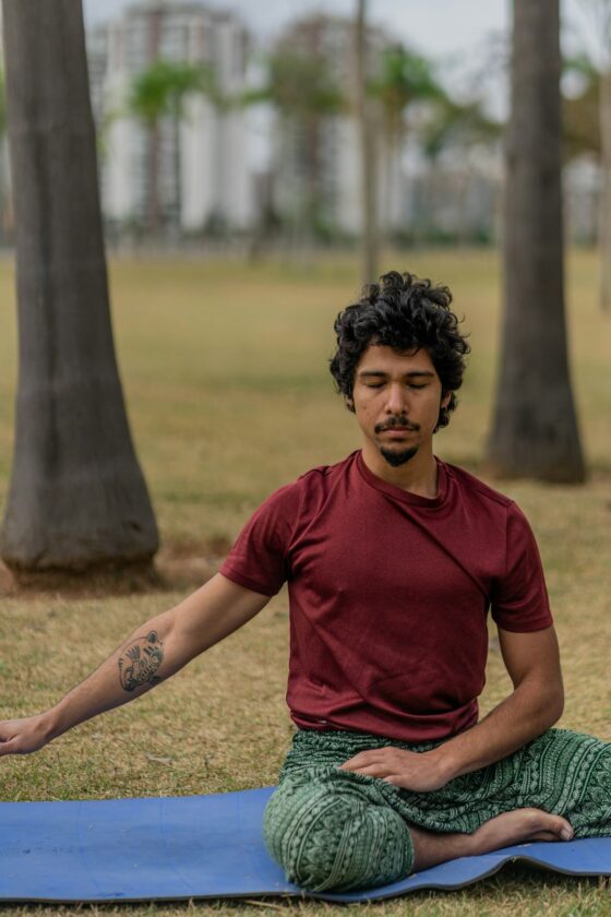 a man sitting on a mat