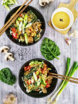 FITPULSE | Quick & Healthy Dinner Recipes in 30 Minutes two black bowls filled with food next to chopsticks