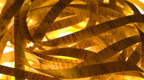 a pile of measuring tape sitting on top of a table