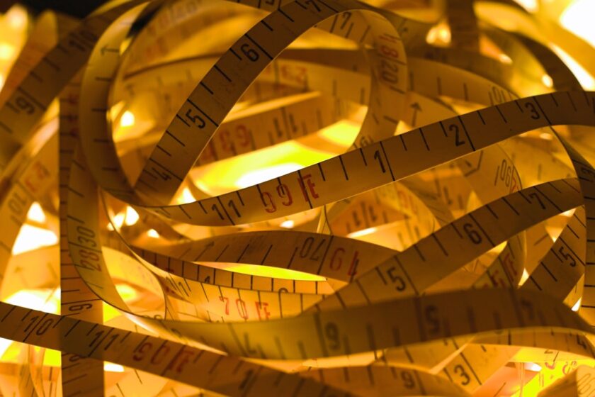 a pile of measuring tape sitting on top of a table