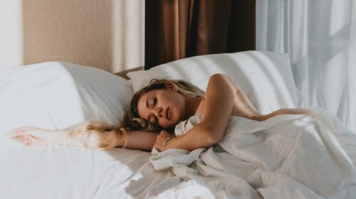 a woman lying on a bed
